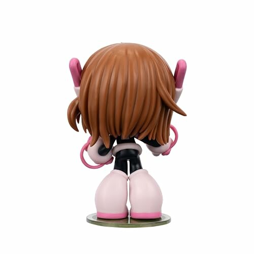 Back view of a small anime figure with brown hair and pink gloves.