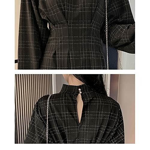 Close-up of a black plaid dress with back button detail