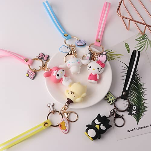 Colorful cartoon character keychains on a plate with lanyards.