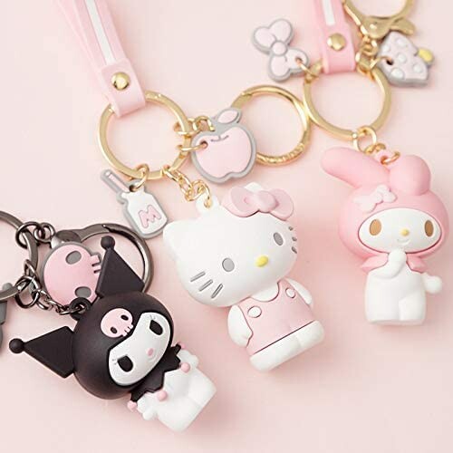 Cute character keychains with pink and black designs.