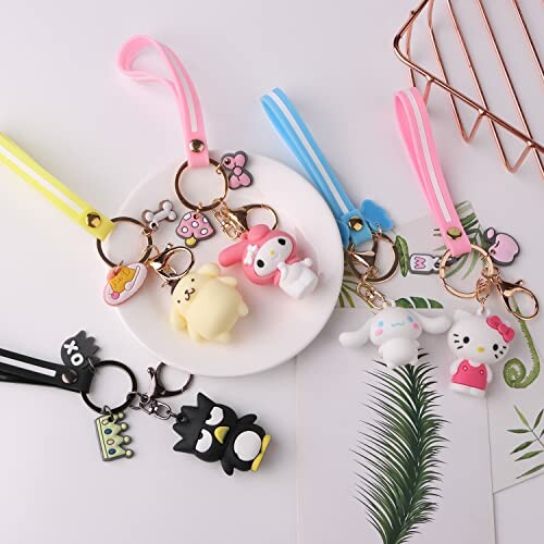 Collection of cute character keychains on a table.