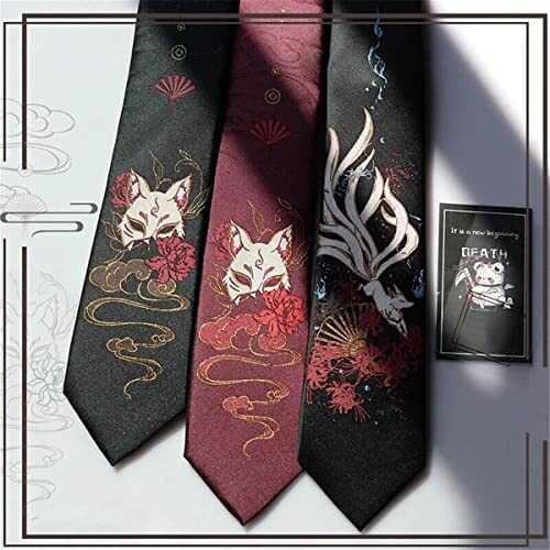 Three neckties with kitsune designs and a postcard.