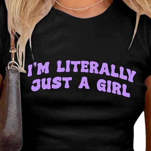 Woman wearing a black shirt with 'I'M LITERALLY JUST A GIRL' text in purple.