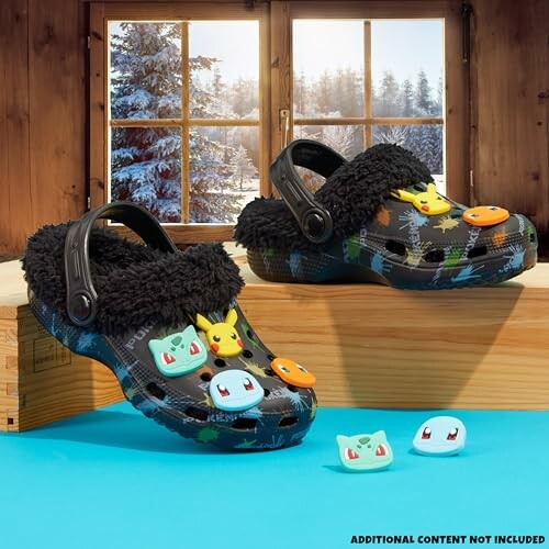 Pokemon-themed Crocs with plush lining and character decorations near a snowy window.