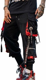 Person wearing black cargo pants with red accents and graphic details.