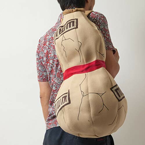 Person wearing a backpack shaped like a sumo wrestler.